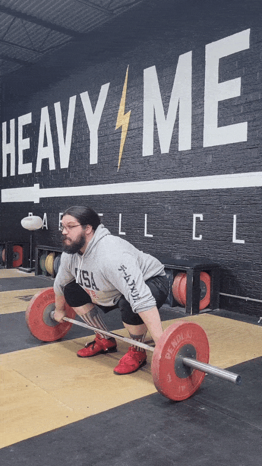 Man performing a Lasha pull with a snatch grip