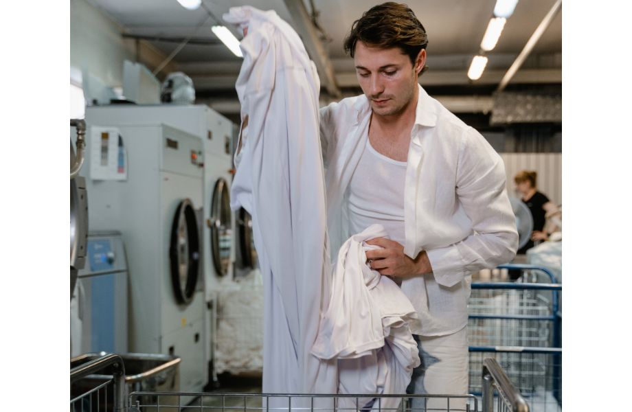 laundry detergent for sweaty clothes man in laundromat