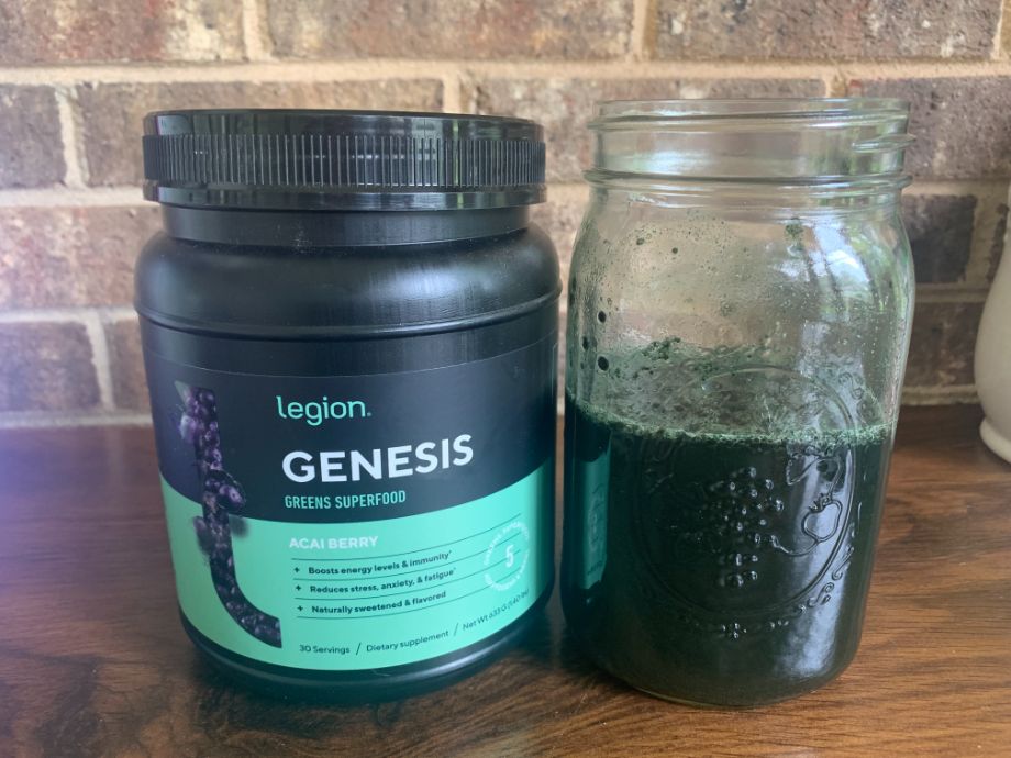 Container of Legion Genesis Greens and glass of mixed greens powder 