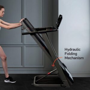 Woman folding the Lifepro Foldable Treadmill.