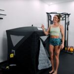 Lindsay Scheele, CPT, stands next to a SaunaBox Go