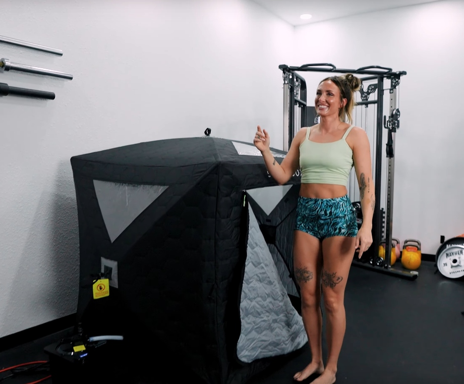 Lindsay Scheele, CPT, stands next to a SaunaBox Go