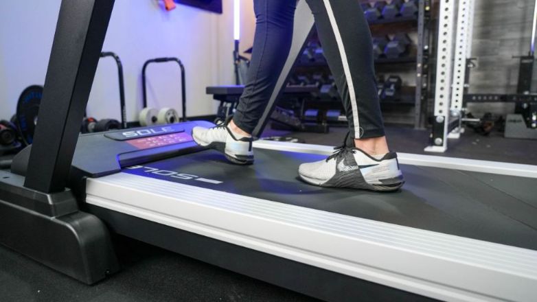 woman walking on sole f80 with sneakers