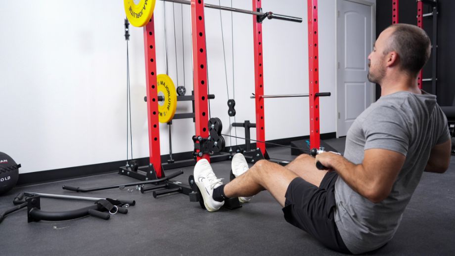 Man performing seated rows on the Major Lutie Power Rack