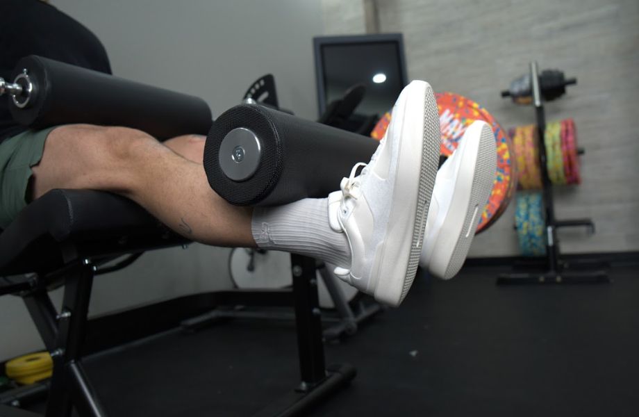 Leg extensions wearing lululemon cityverse sneakers