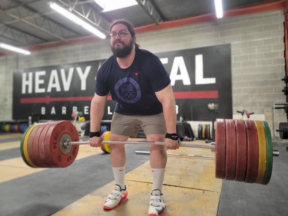 Man deadlifting in the Lululemon License To Train shorts using JerkFit Death Grips