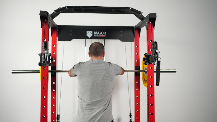 Man inside of the Major Lutie Power Rack about to squat