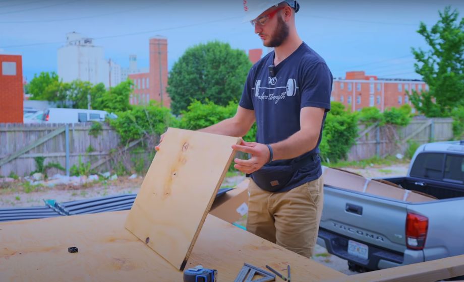 Man eyeing wood for diy pulling block