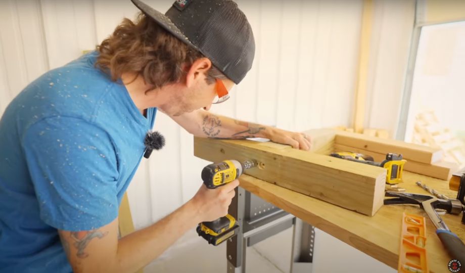 man making a DIY weight bench