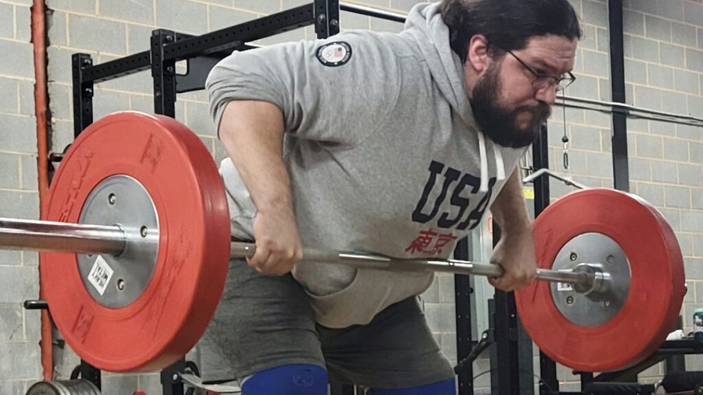 Man doing bent-over barbell rows