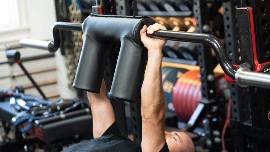 Man using the REP Fitness Safety Squat Bar