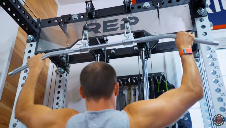 Man doing lat pulldowns on REP Ares