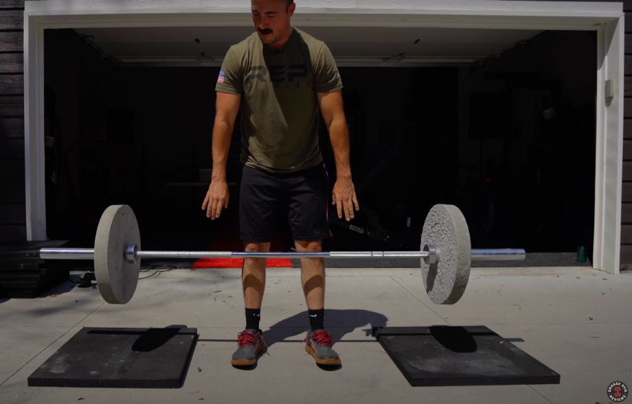 Man dropping DIY weight plates