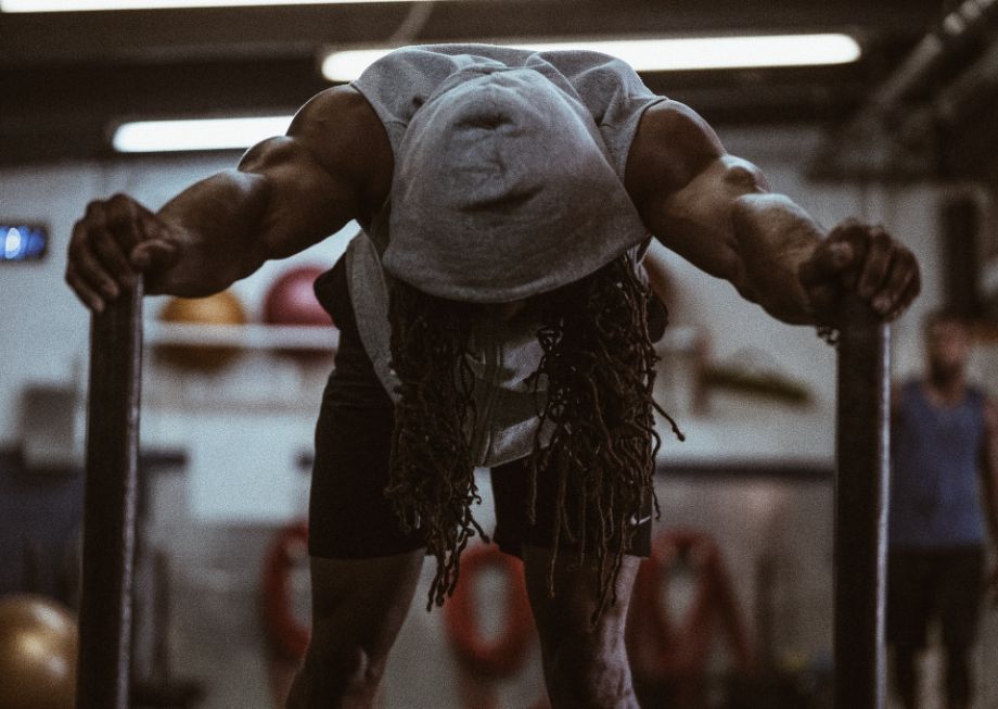 Man performing a weighted sled push