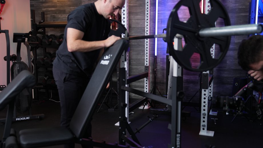 Coop adjusts the backrest on a FLYBIRD Olympic Weight Bench.