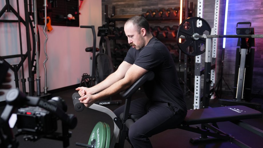 Coop tries doing curls with the FLYBIRD Olympic Weight Bench. 