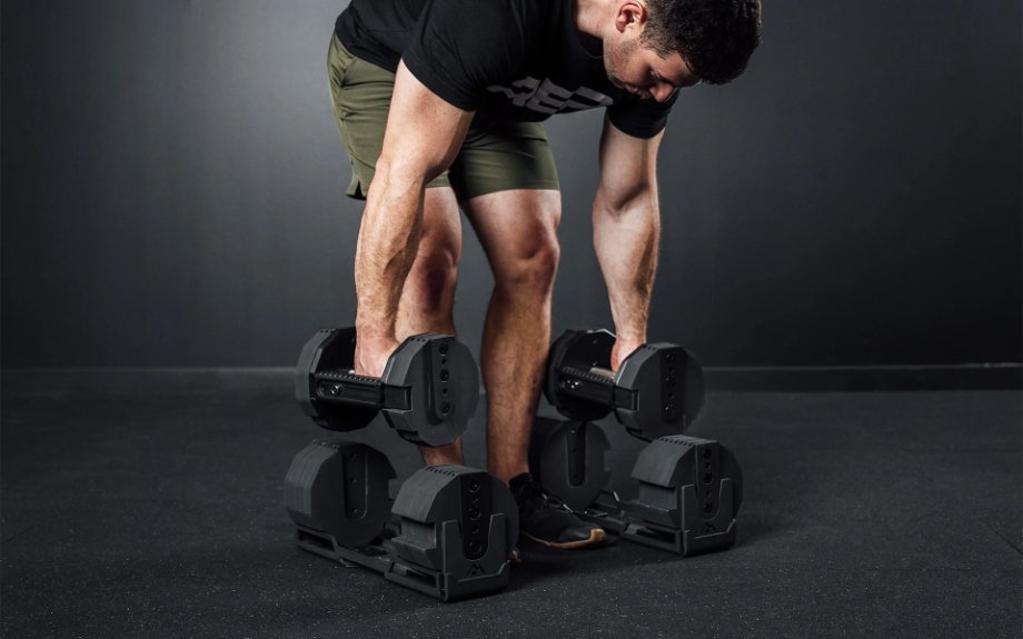 A man using REP x PEPIN Fast Series Adjustable Dumbbells.