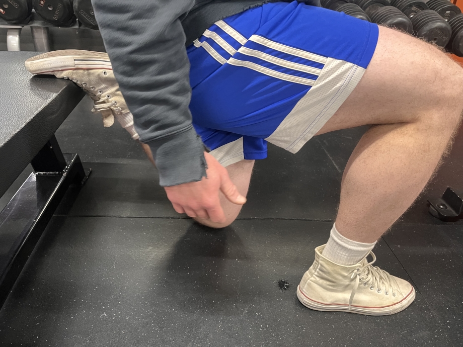 Man works out with Converse Chuck Taylor shoes.