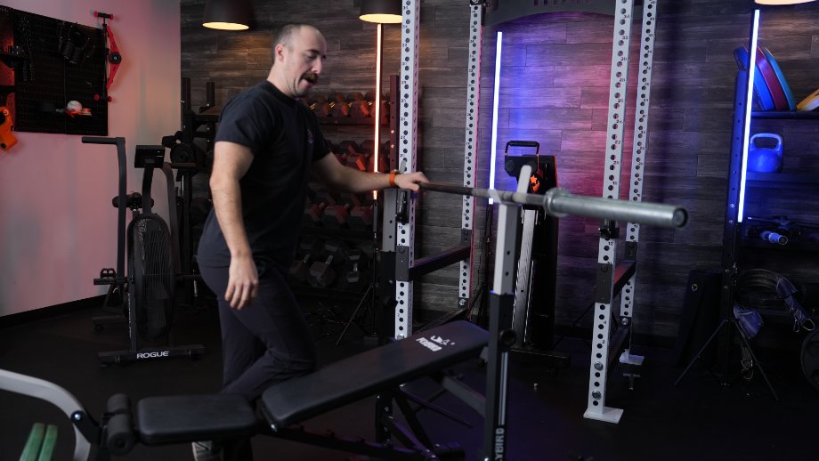 Coop stands with the FLYBIRD Olympic Weight Bench.