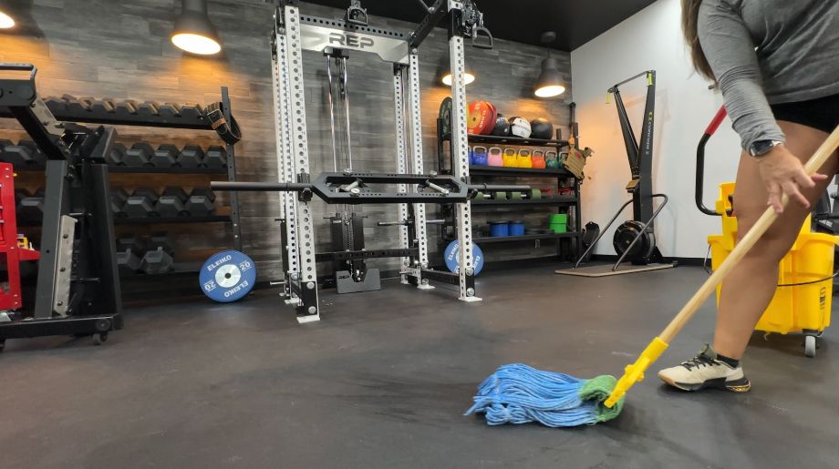 Woman mopping rubber flooring