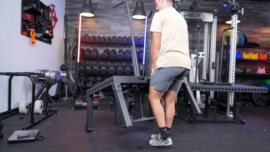 Man moving the freestanding Titan SquatMax-MD