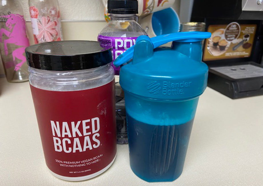 Naked BCAAs next to Poweraid and a shaker botttle.