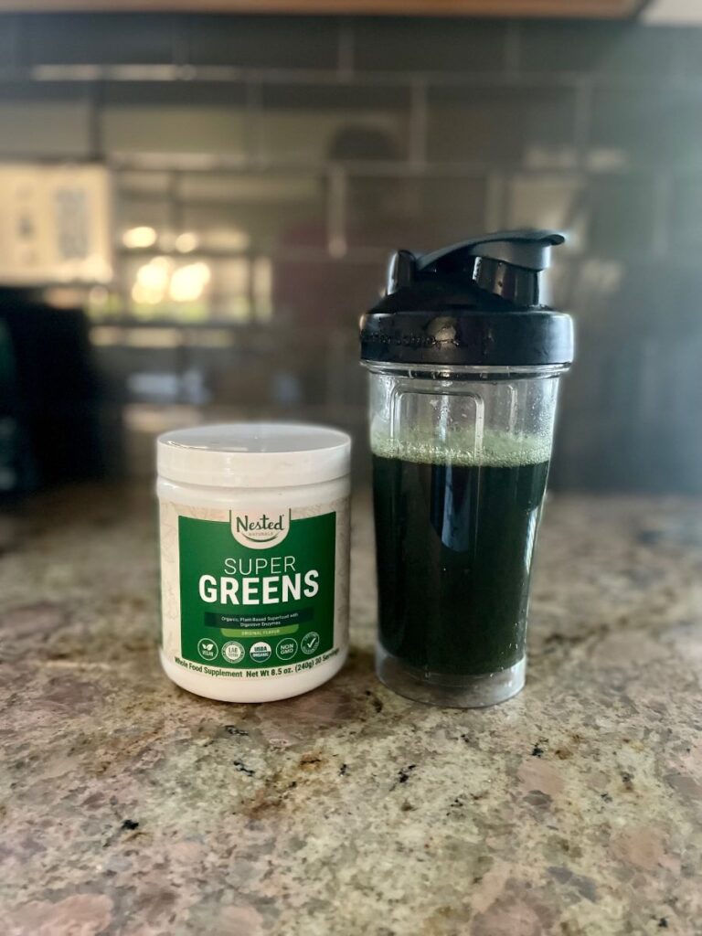 An image of Nested Naturals Super Greens in a shaker