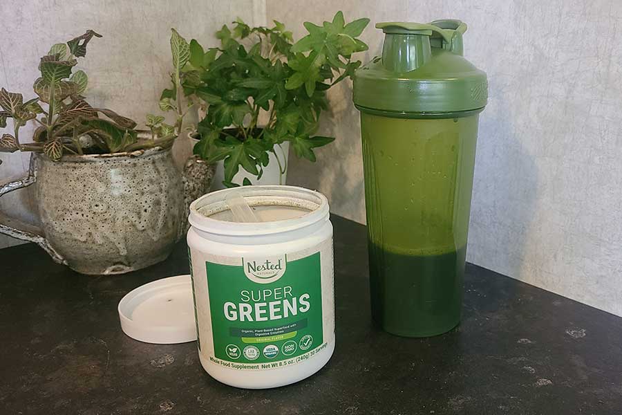 Nested Naturals Super Greens Powder And A Shaker Bottle