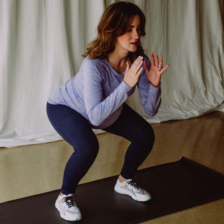 An image of a pregnant woman squatting
