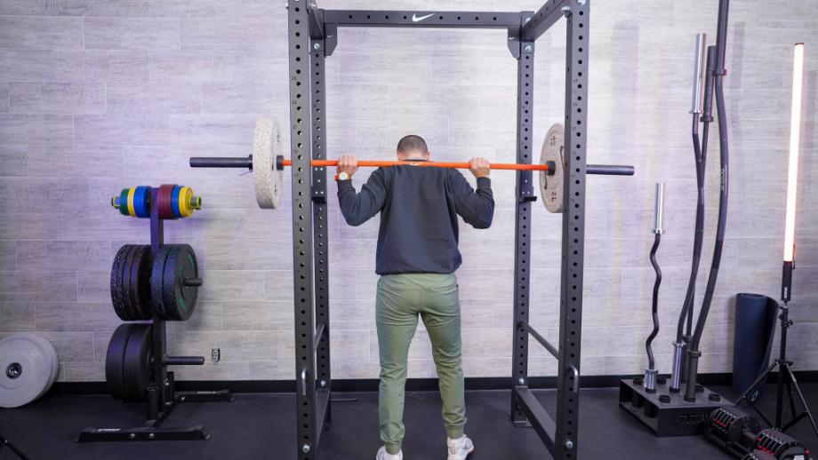 Man using the Nike squat cage for back squats