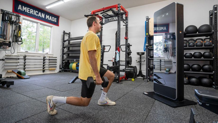 Coop doing lunges during a workout with the NordicTrack Vault - NordicTrack Vault Review