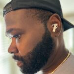 A close look at a Nothing Ear (a) wireless earbud being used by our product tester.