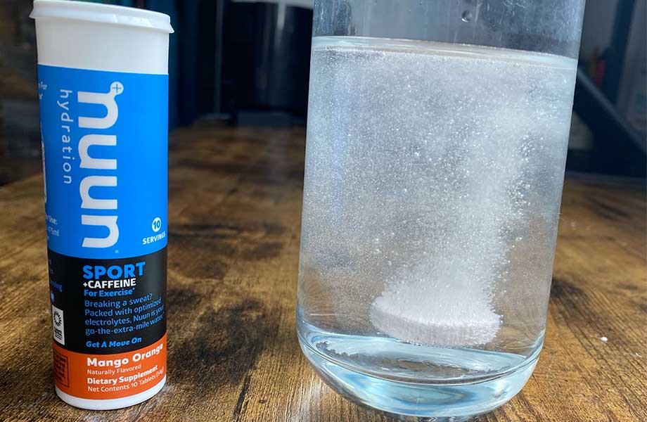 Nuun Sport electrolyte tablet dissolving in a glass
