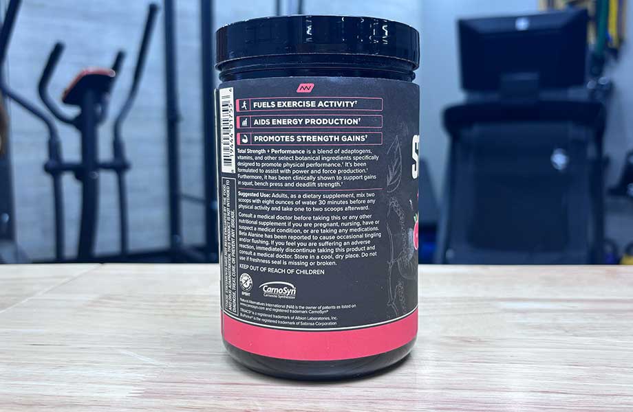 The side of an Onnit Total Strength + Performance container