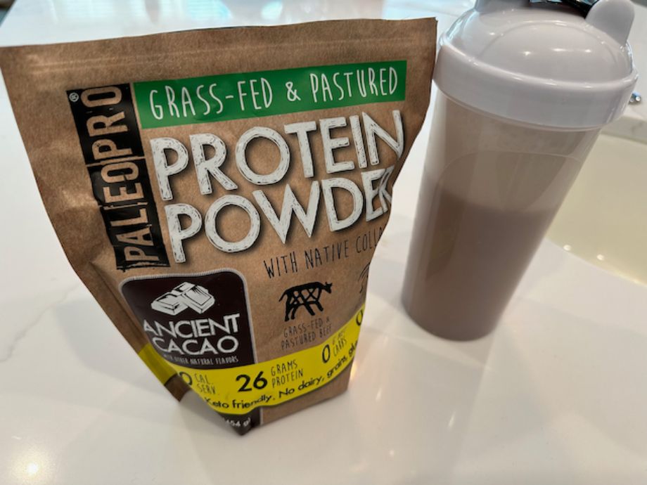 Paleo Pro protein bag next to a shaker cup