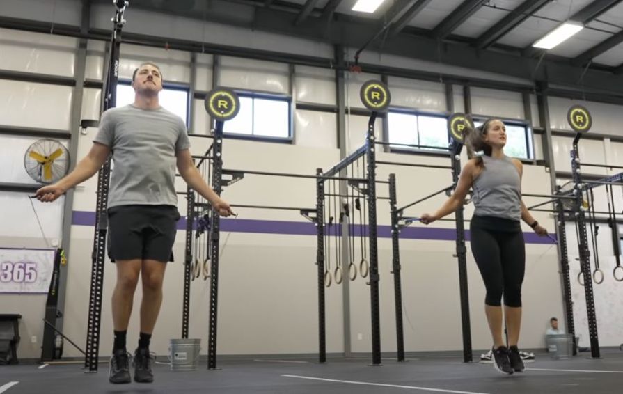 Two people jumping rope