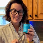 An image of a woman holding Bioniq Go multivitamin