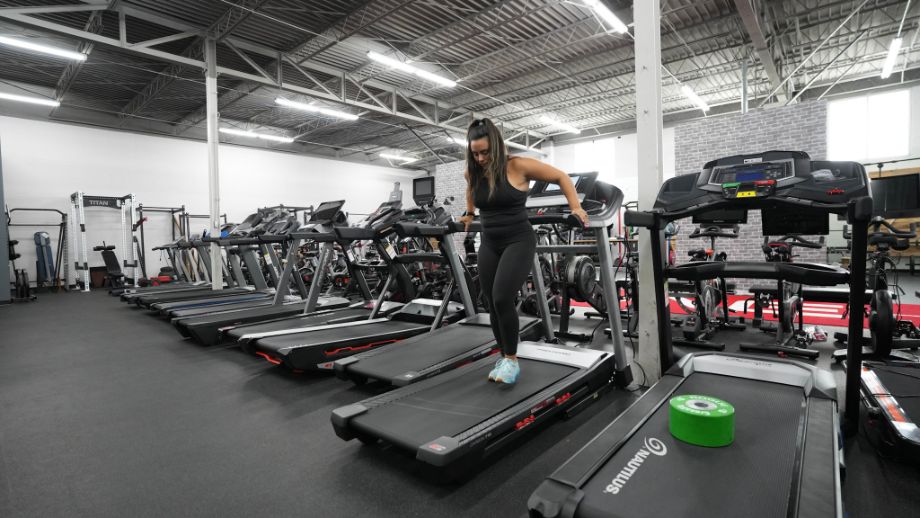 Person walking backward on a treadmill