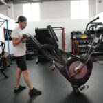 person moving schwinn 470 elliptical