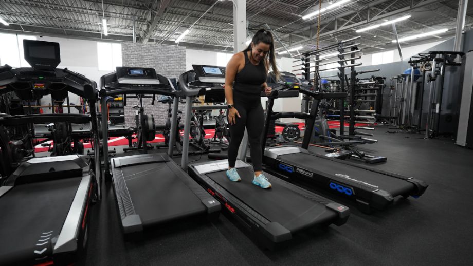 person using treadmill to walk backward