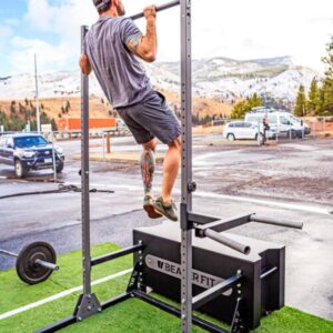 Photo of man performing pull-up on BeaverFit Gym Box bar.
