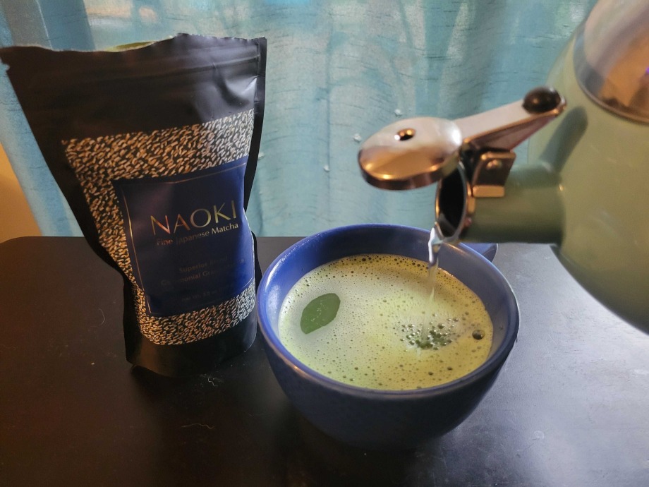 Our tester pouring a cup of Naoki Superior Blend Matcha