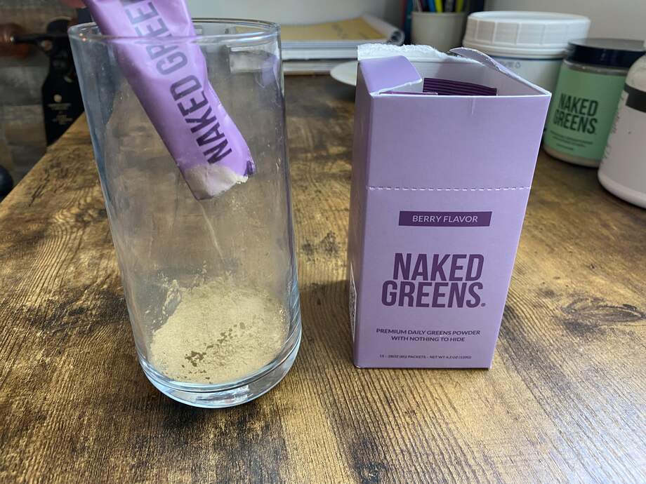 Pouring Naked Greens Berry Flavor Into Glass 2