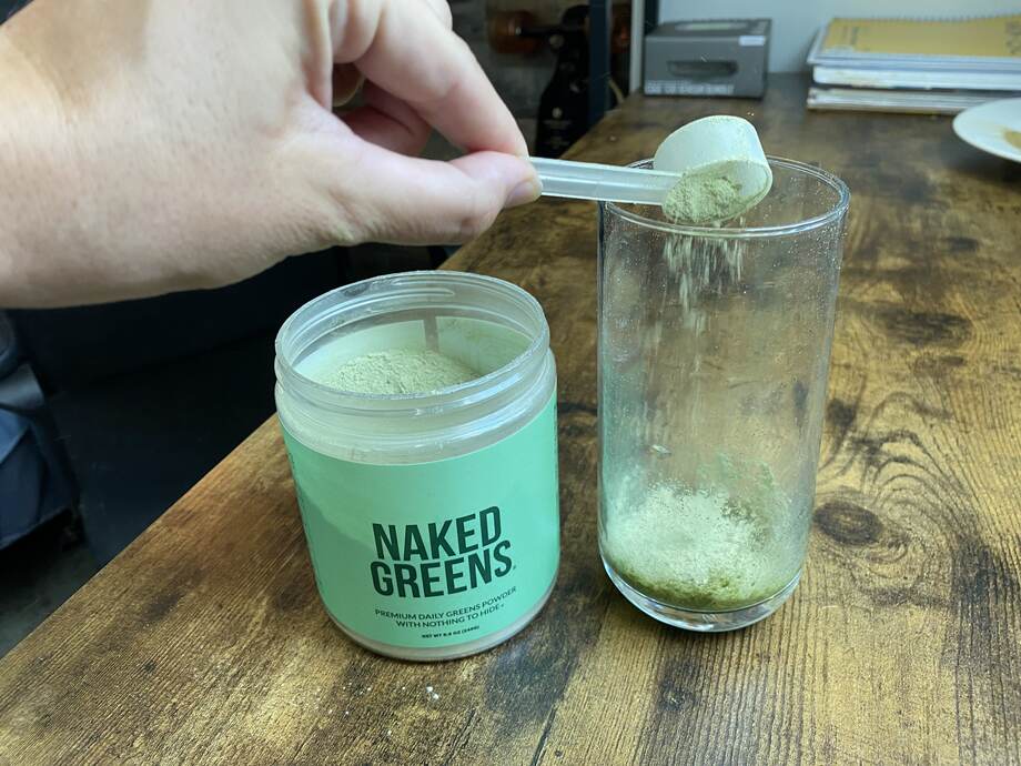 Pouring Naked Greens Into Glass 2