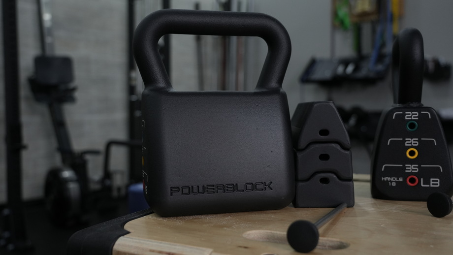 A close-up view of thePowerBlock Adjustable Kettlebell and the components.