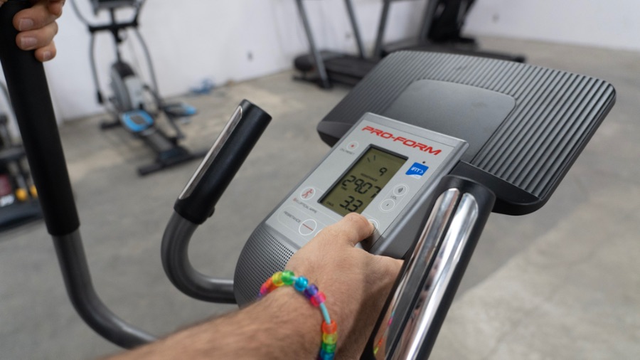 Man using the monitor on the ProForm Hybrid Trainer XT