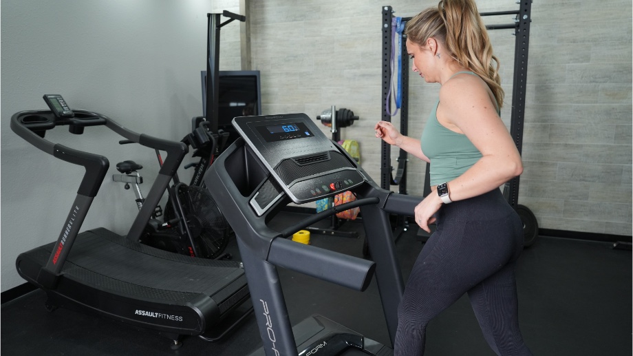 An image of a woman walking on the ProForm TLX treadmill