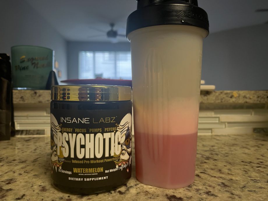 psychotic preworkout next to blender bottle