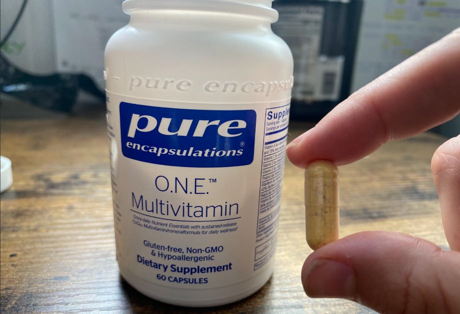 Pure encapsulations multivitamin in hand