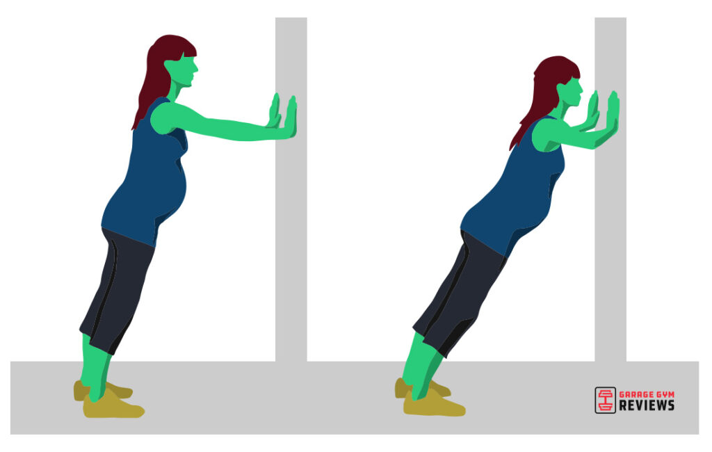 Pregnant person doing wall push-ups